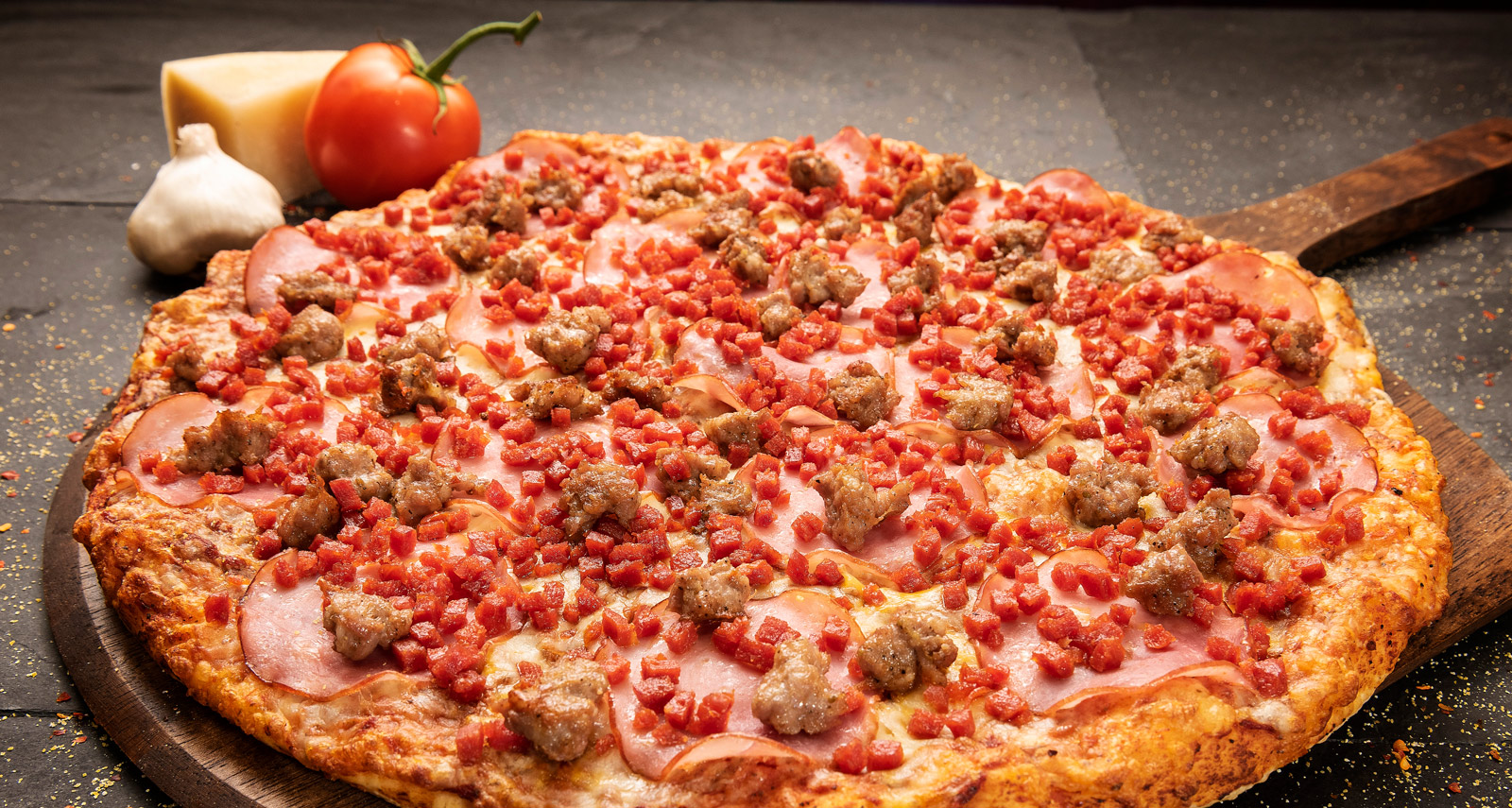 Close-up image of a Classic All Meat pizza